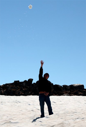 David flinging a snowball.